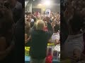 A roll of victory in hand and the crowd's energy at its peak!"