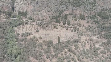A-Log. Delphi, Greece. Ruins of the ancient city of Delphi. Sunny weather, Summer, Aerial View, Poin