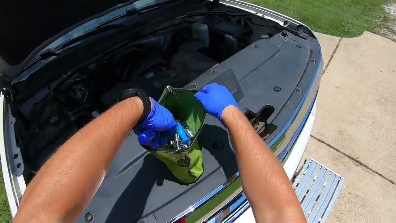 long flat razor knife insertion for windshield bottom seal removal Silverado interior view
