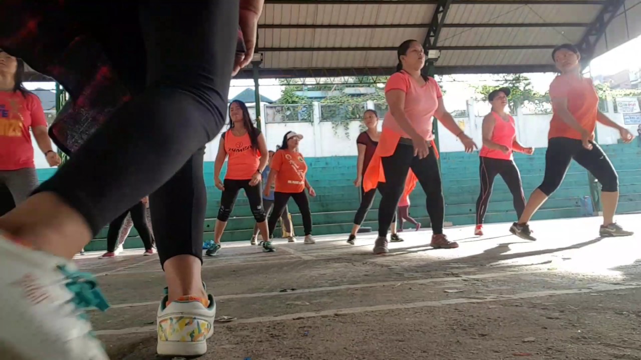 Mrb zumba in orange dancing in the street