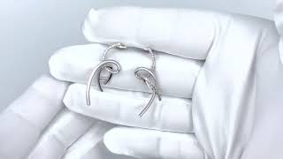 Vidéo: Boucles d'oreilles pendantes en or gris 18Cts avec 0,5 Ct de diamants brillants.