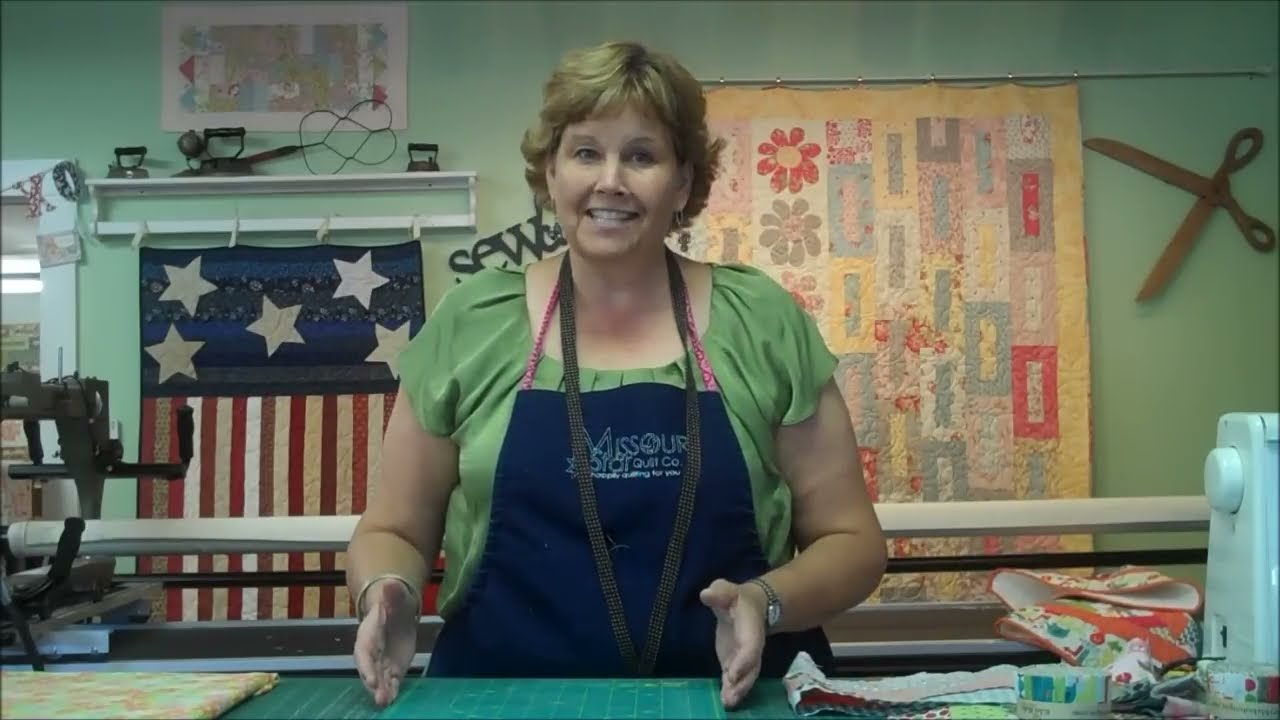 Jenny Doan working with jelly roll strip sets