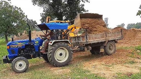 Jcb3dx loading mud into the trolly of tractor , eicher 380 loded by jcb