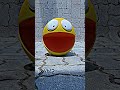 Yellow Pac Man smiling warmly on the red wooden floor Yellow Pac Man smiling warmly on the red wooden floor