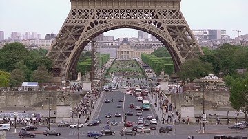Traffic under the Eiffel Tower. Slow Motion