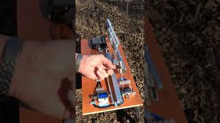 Line clamp mechanism and release attached to strike arm.