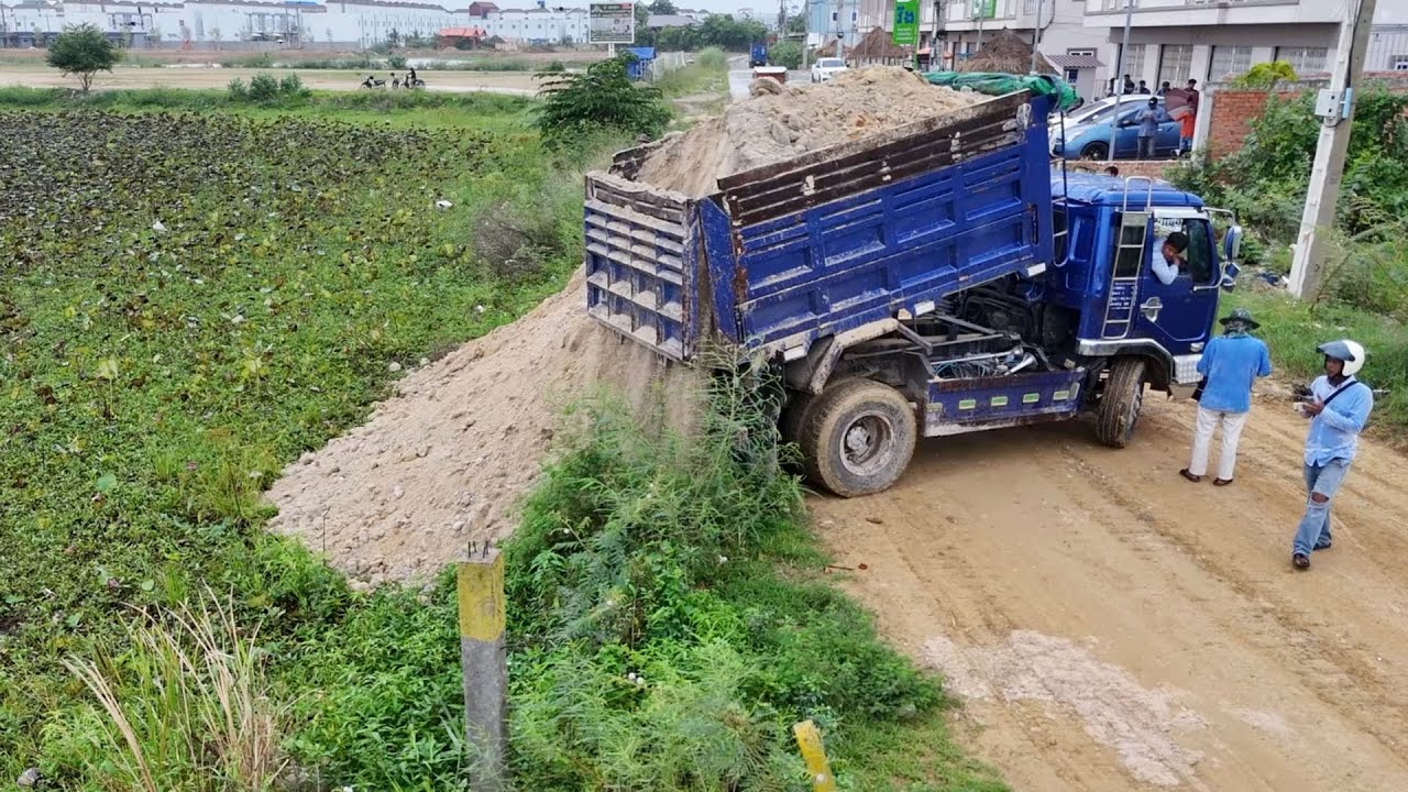First 5ton Dump Truck Unloading & Dozer D58E KOMAT’SU Technique Filling Land Fill flooded soil