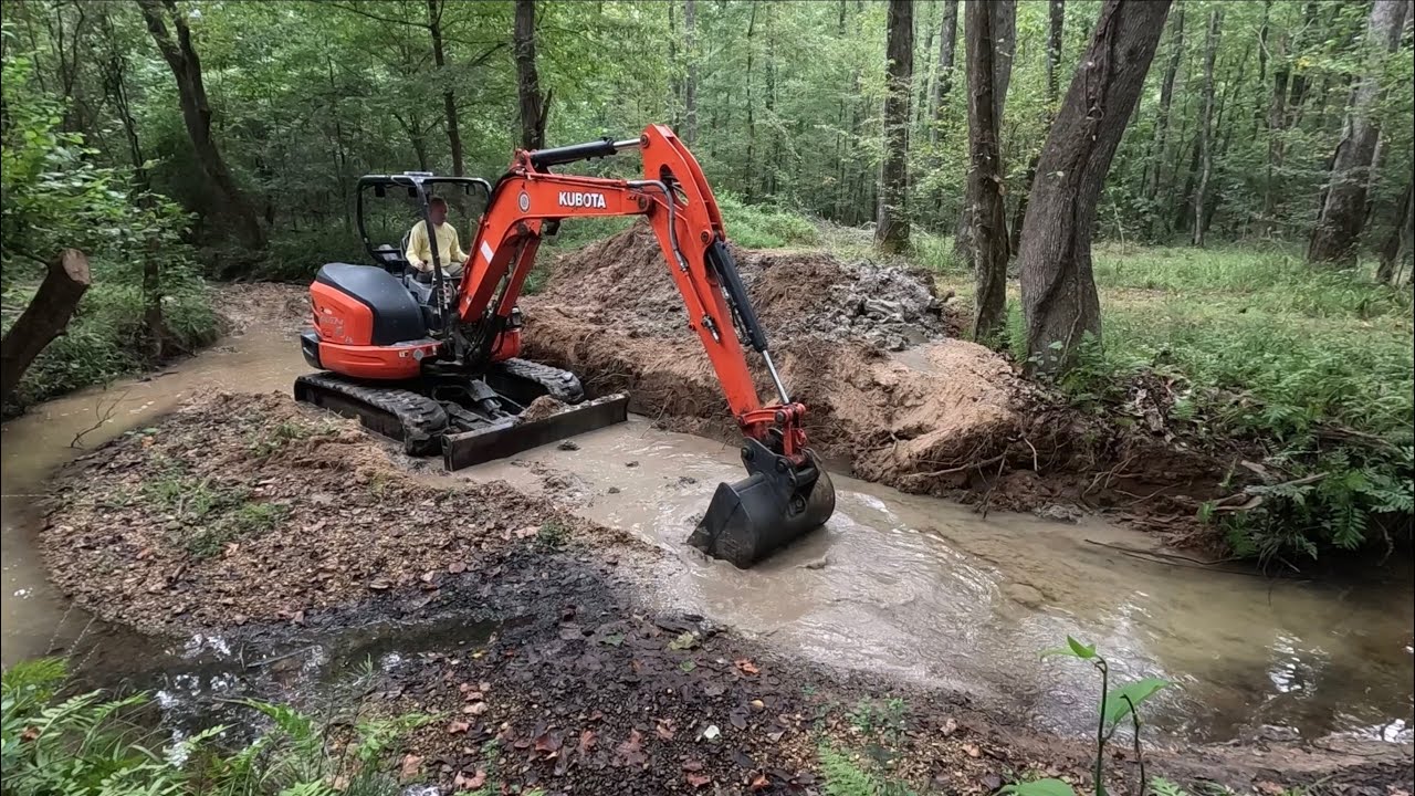Straightening a creek run out with a mini excavator
