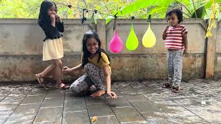 Water balloon pop with sis