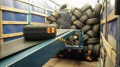 Telescopic conveyor unloading tires and cartons - LOADmaster