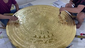 Dát vàng mặt trống đồng