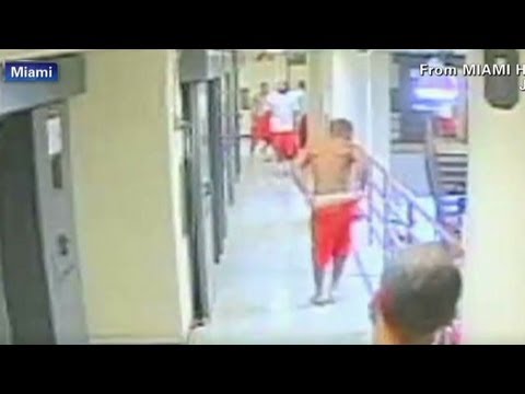 Inmates attack a fellow prisoner after cell doors open - YouTube