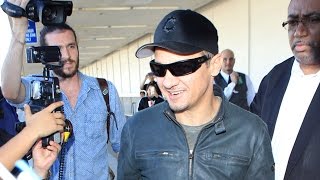 Jeremy Renner Wears A Smile Returning To LA