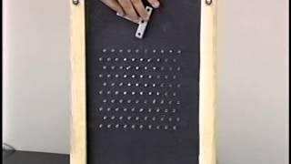 A Reconfigurable Parts Feeder with an Array of Pins