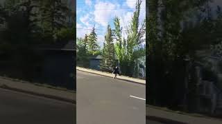 Girl falls off motorcycle and lands on sidewalk