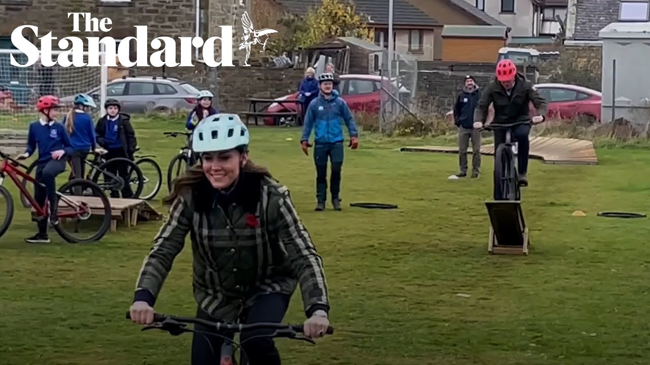 William and Kate cheered as they show off bike skills