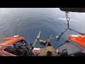 U.S. Coast Guard helicopter gunner shoots smuggling boat's engines