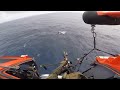 U.S. Coast Guard helicopter gunner shoots smuggling boat's engines
