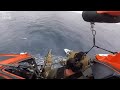 U.S. Coast Guard helicopter gunner shoots smuggling boat's engines