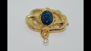 Black opal Handmade brooch 18kt gold with a black opal at the center