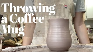 Throwing on the Pottery Wheel for Beginners. A Coffee Mug