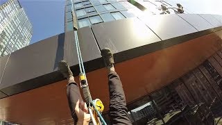 Rope access window cleaning with rigging and lots of the drop.