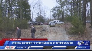 Person accused of pointing gun at officers shot
