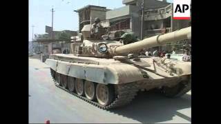 Troops flood Sadr City, minibus bomb kills 2, roadside bomb wounds 3