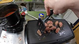apathetically making meatballs and sauce