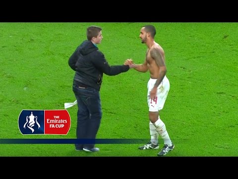 Theo Walcott celebrates with fan after FA Cup game v Sunderland | Snapshots