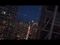 Aerial oblique angle shot of nighttime Toronto cityscape with modern skyscrapers and city streets