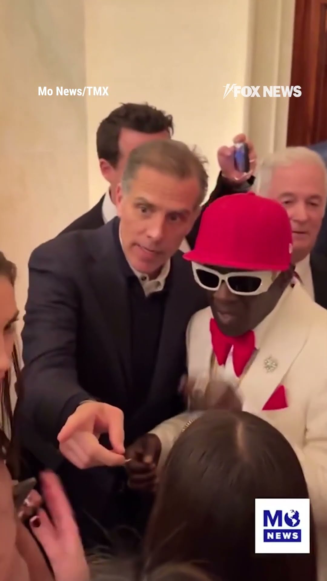 Hunter Biden gets friendly with Flavor Flav during Christmas party at the White House