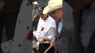 Carney attempts to flip pancakes at Calgary Stampede