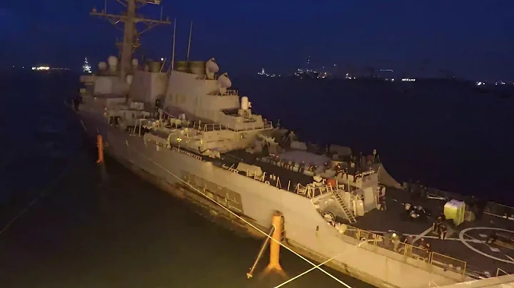 USS John S McCain being moved in Preparation for on Load to the Heavy Lift Vessel MV Treasure