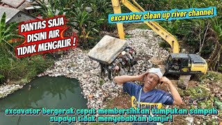 Excavator quickly clears river trash to prevent flooding