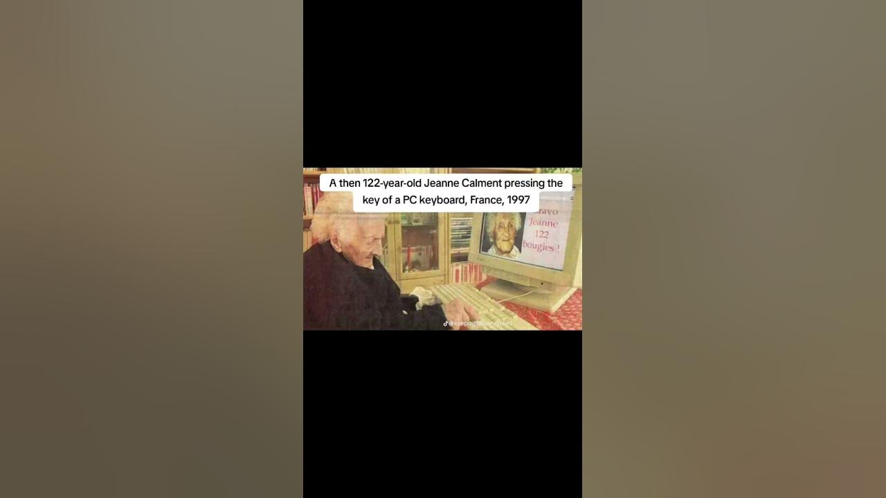 A then 122-year-old Jeanne Calment pressing the key of a PC keyboard, France, 1997.