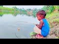 Little boy hunting big fish by rod  traditional hook fishing in the river