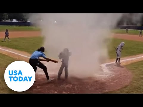 Quick-thinking umpire rescues kid caught in dust devil | USA TODAY