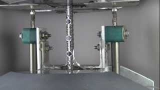 Cyclic axial response tested on a short reinforcing bar