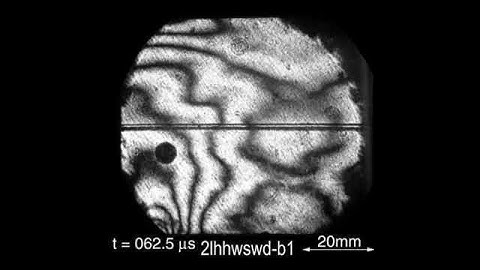 Dynamic interfacial debonding ahead of a main incident crack