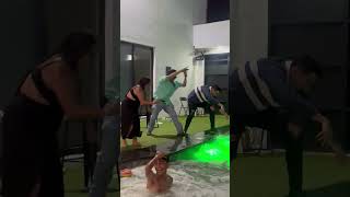 Friends' Playful Push Leads To Double Pool Splash