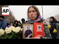 Hundreds gather at funeral for Alexei Navalny