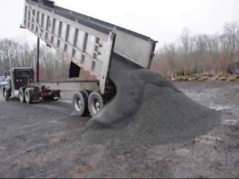 Dumptruck Dumping a Load Of Gravel - YouTube