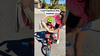 I use a towel to help teach my son how to ride a bike 🚲 way to go Coops! #bikeride #firstbike #mom