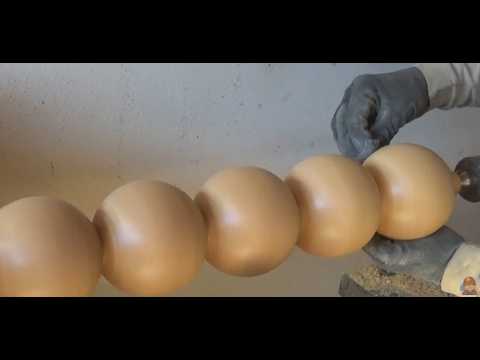 Turning 5 spheres on a wooden column