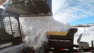 hauling out a huge snow drift with my new dump trailer