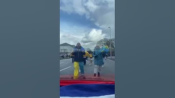 A Car with a Russian flag in front of Ukrainians protestors in Germany #kyiv #ukraine #киев #украина
