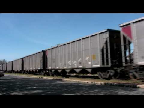 ES44ACs 930 and 757 hustle empty coal hoppers northbound through Ashland, Virginia on April 18, 2009.