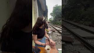 People Relax at Cafe While Waiting for Train