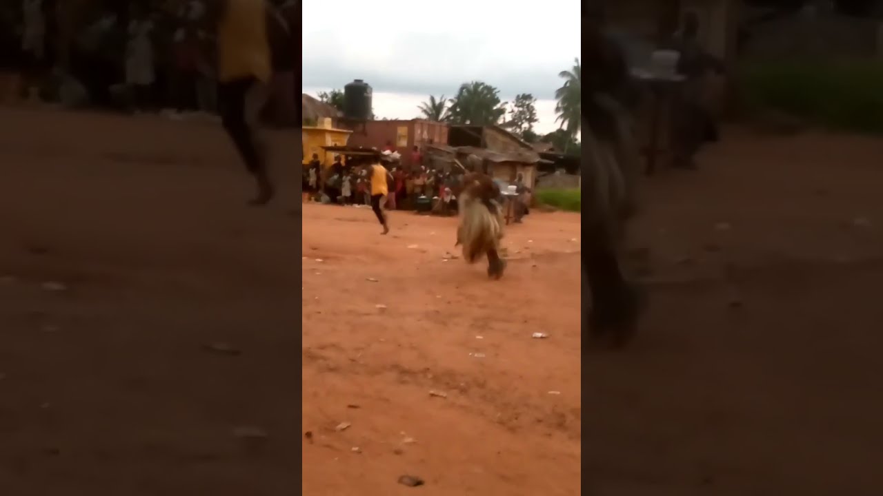 Masquerade chasing people in Africa